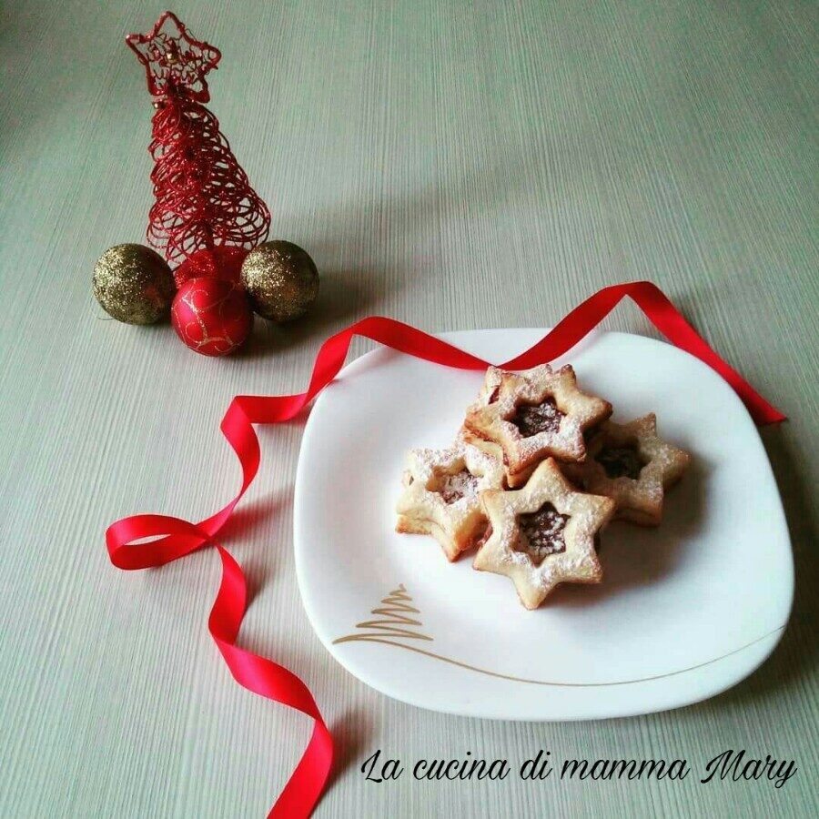 Biscotti stelle di natale ripiene di nutella