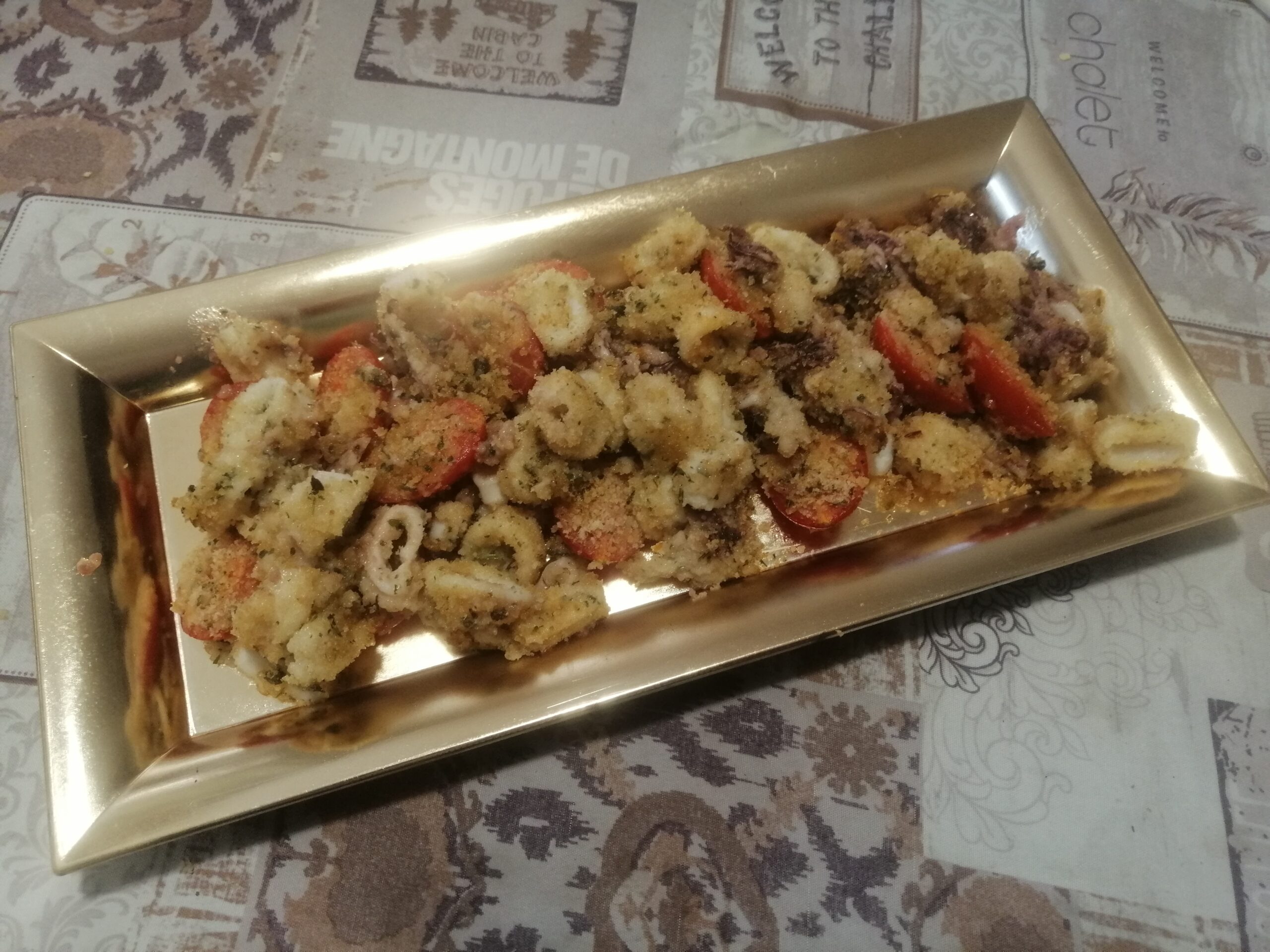Calamari e pomodorini gratinati al forno