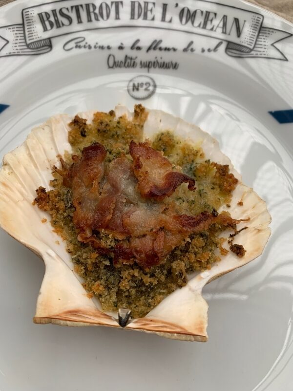 Capesante gratinate con lardo di colonnata