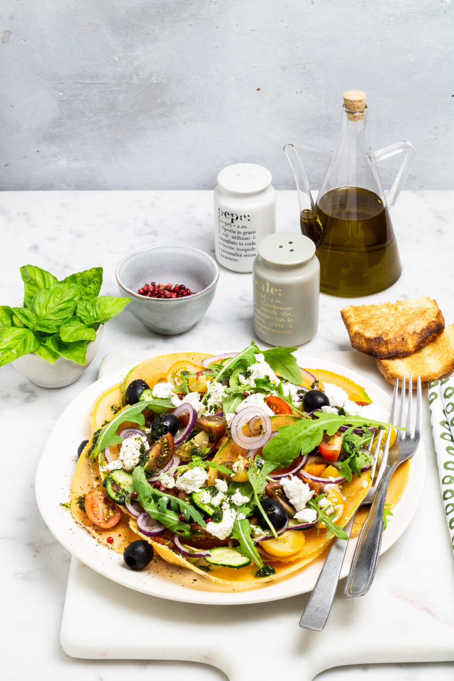 Carpaccio di melone con pomodorini, rucola e feta