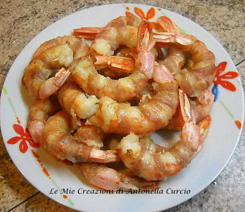 Code di gamberi con pancetta al forno