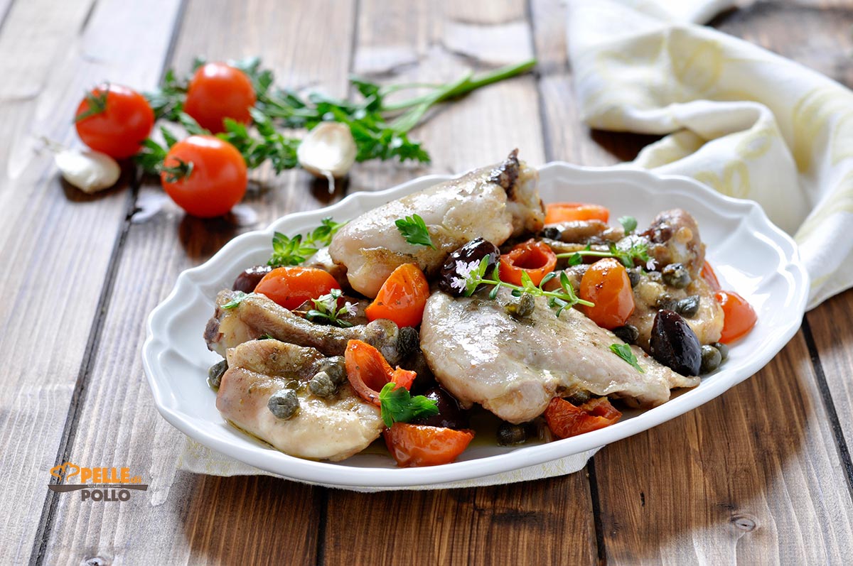 Cosce di pollo al forno con olive, erbe aromatiche e capperi