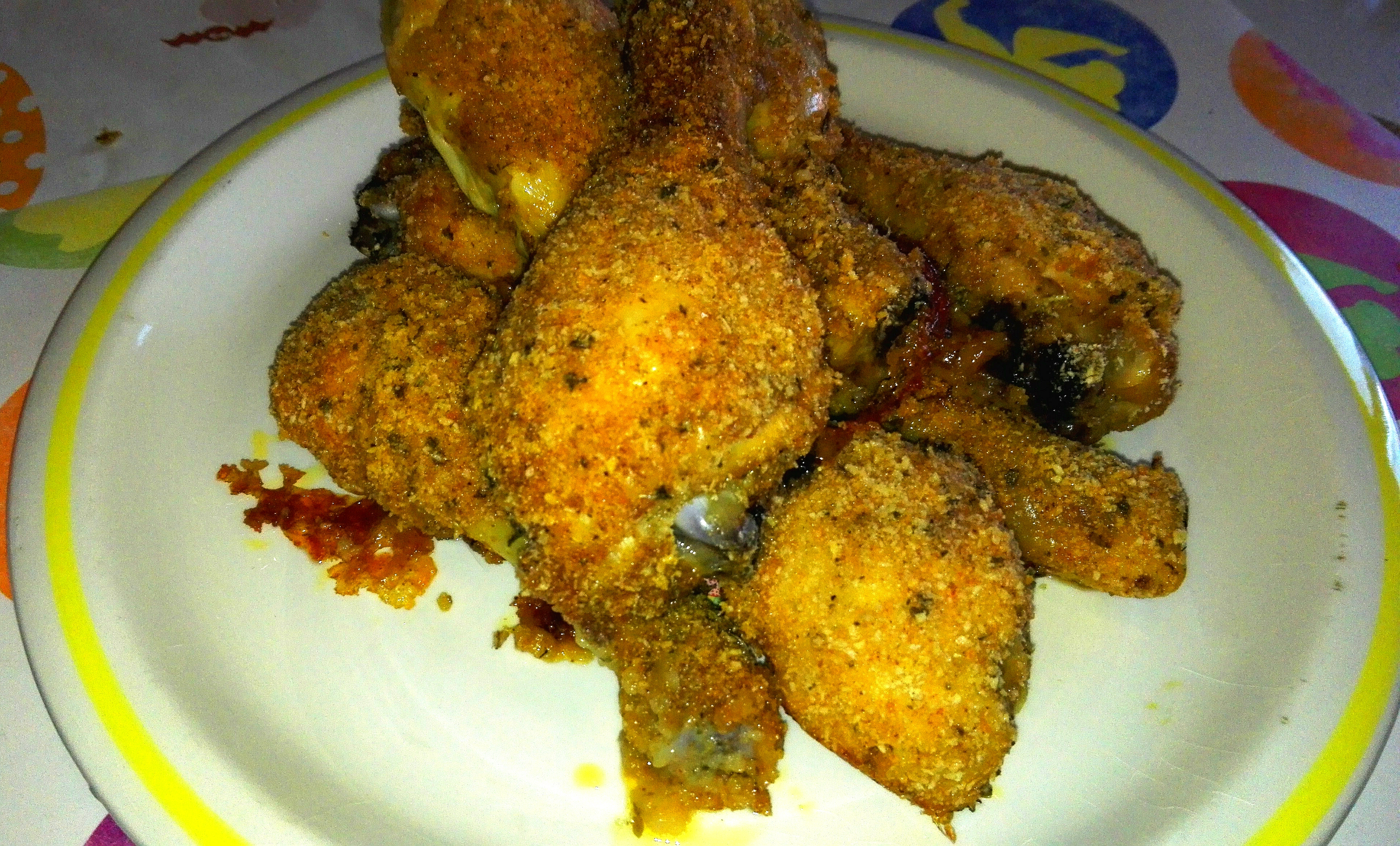 Cosce di pollo panate e aromatizzate al forno