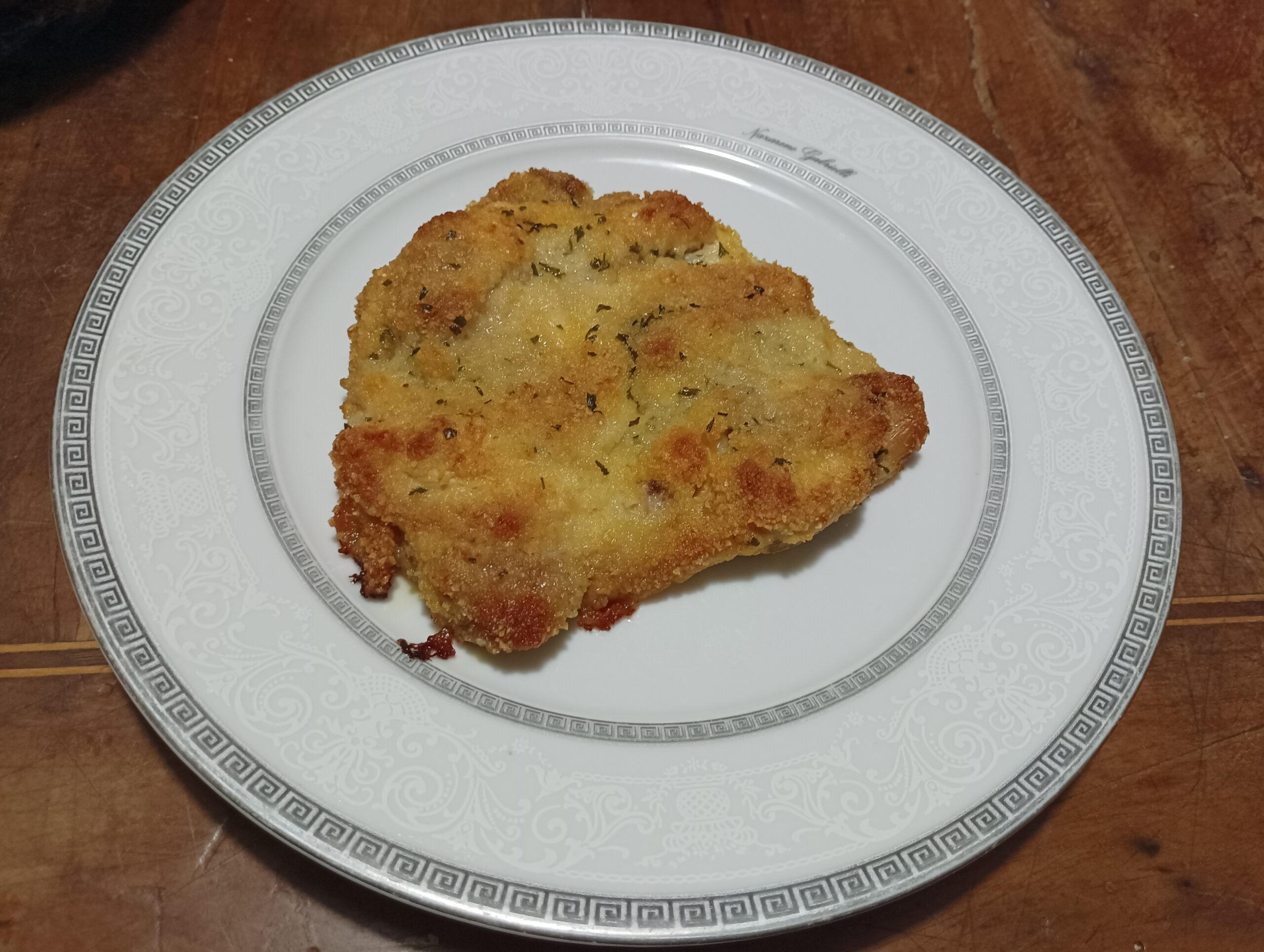 Coscia di pollo disossata e impanata al forno