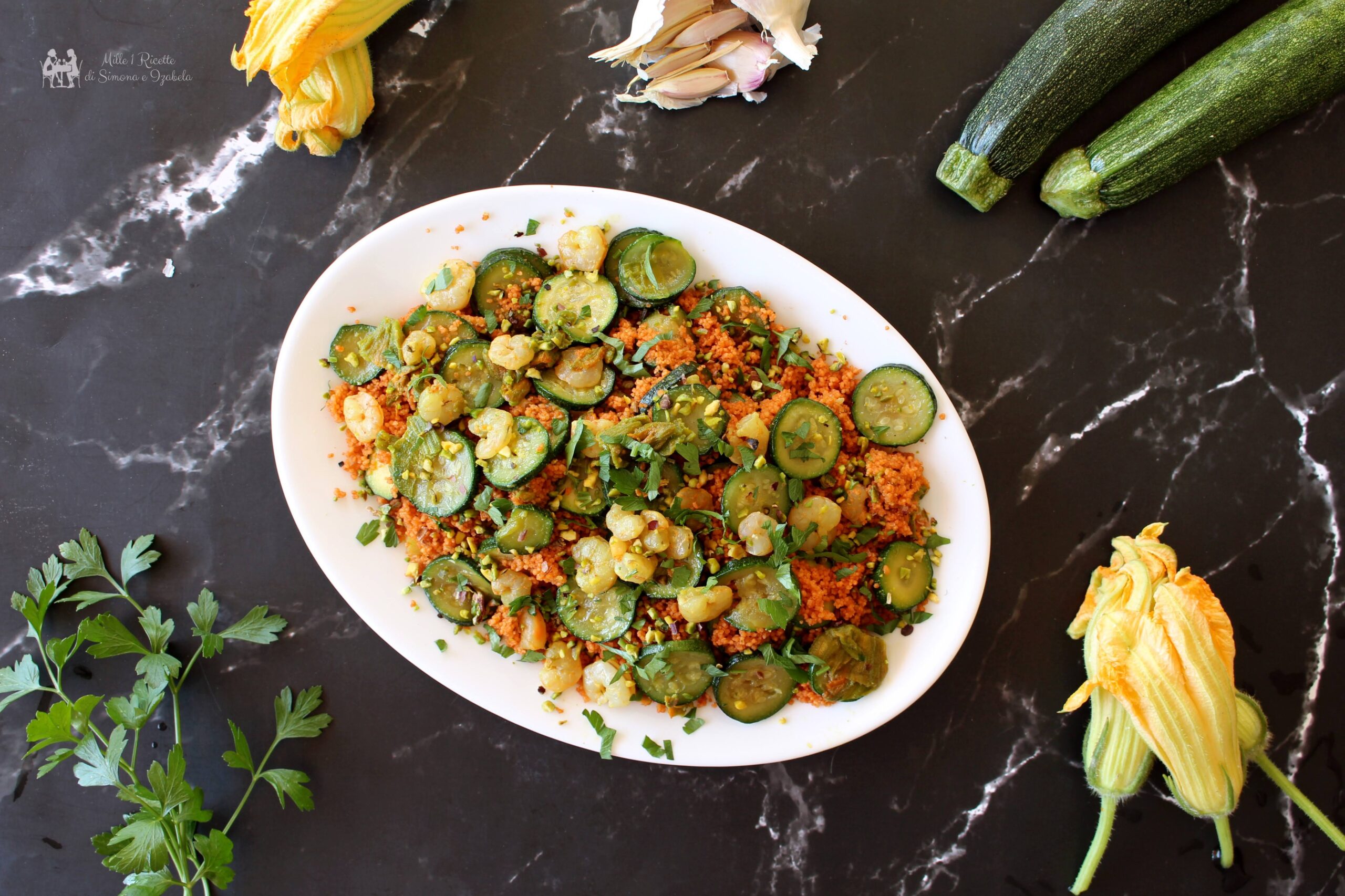 Cous cous alla bisque di gamberi con zucchine e fiori di zucca