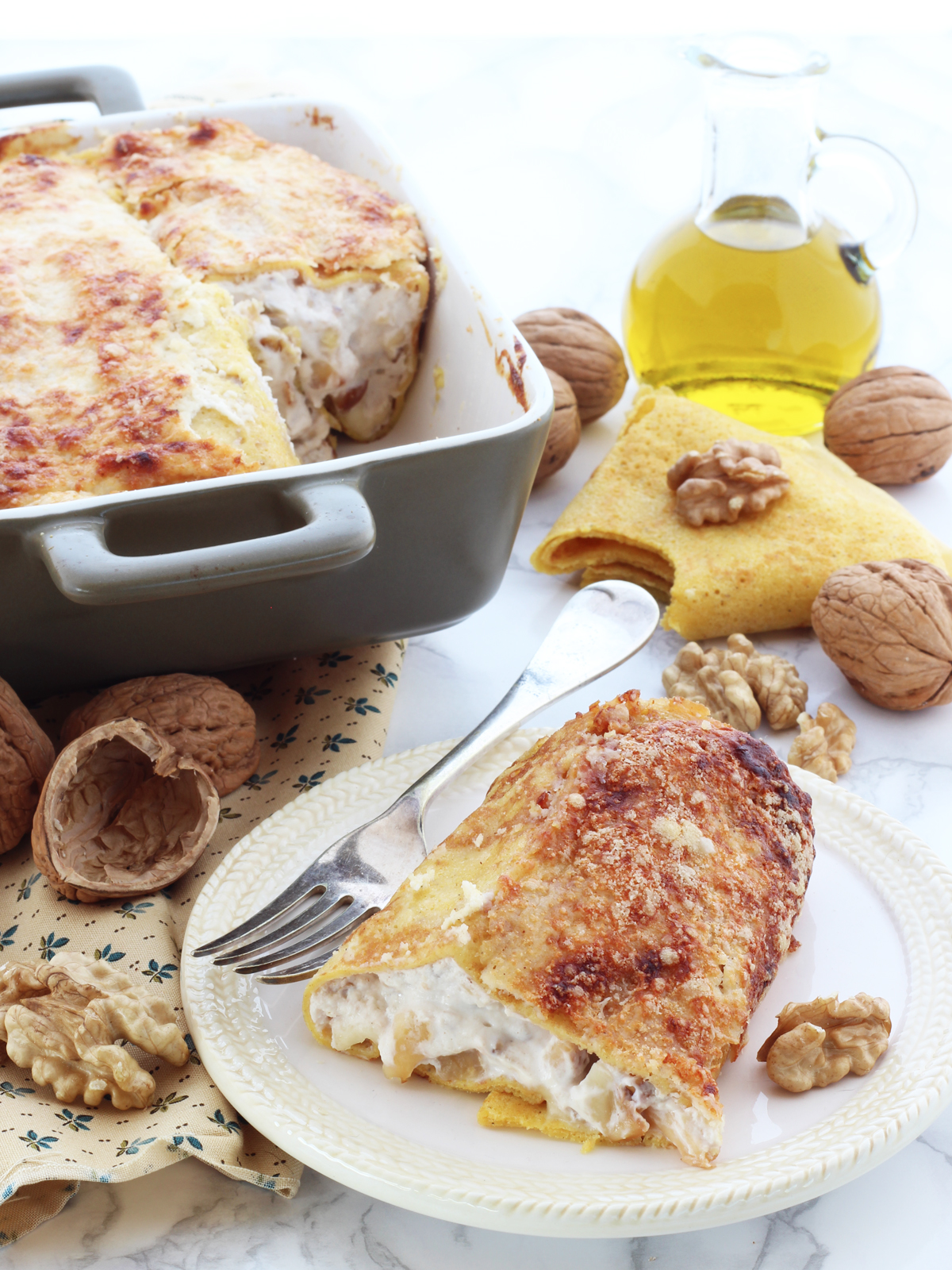 Crespelle con ricotta, noci e scamorza