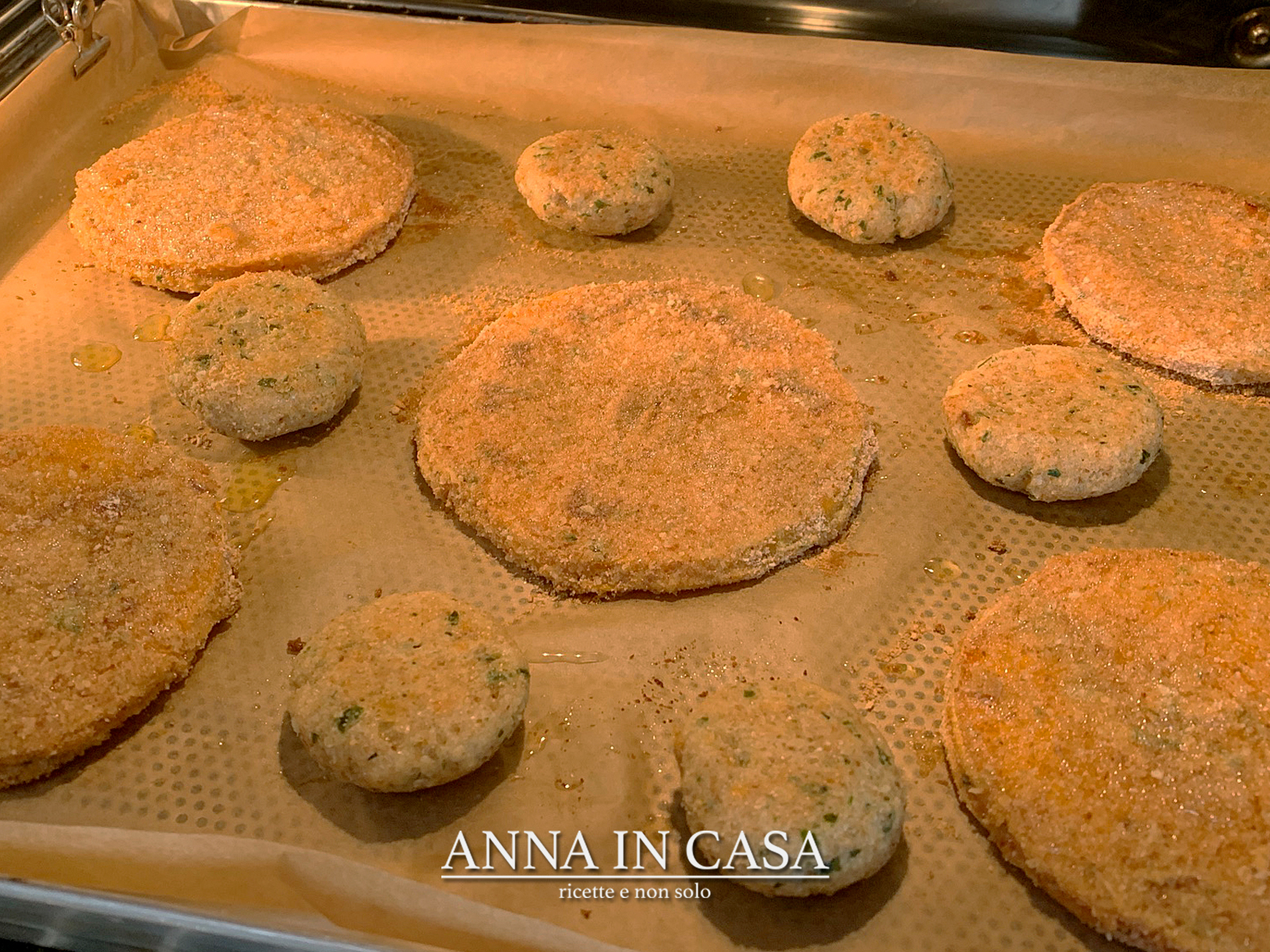 Fettine di zucca panate al forno e polpettine di pane
