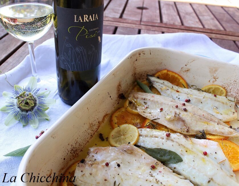 Filetti di branzino al gavi, pepe rosa ed agrumi
