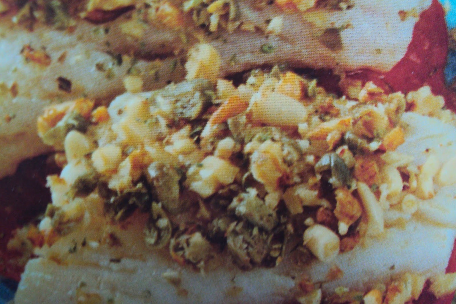 Filetti di nasello al trito di noci e pinoli