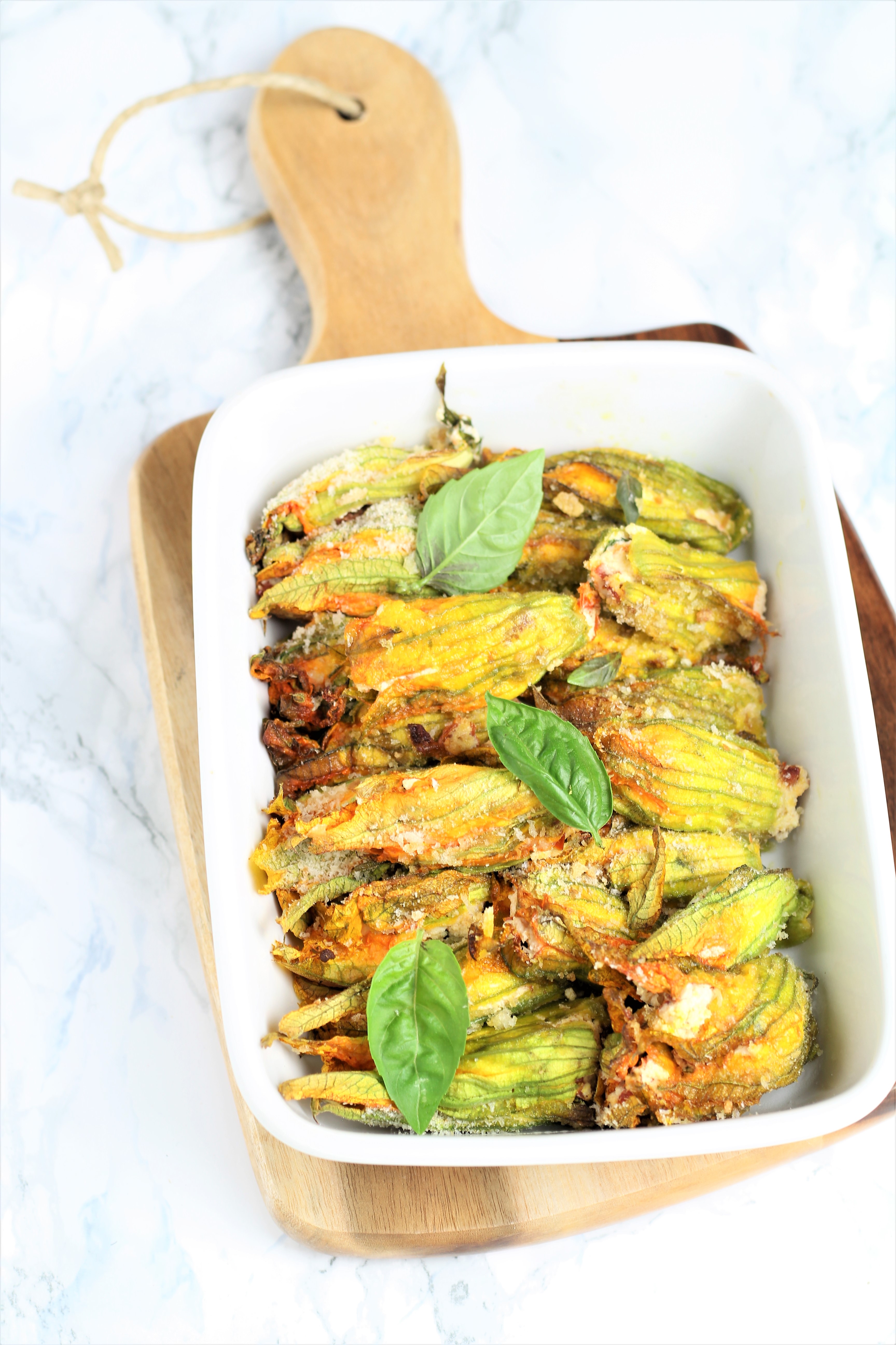 Fiori di zucca ripieni con ricotta di capra e pomodori secchi