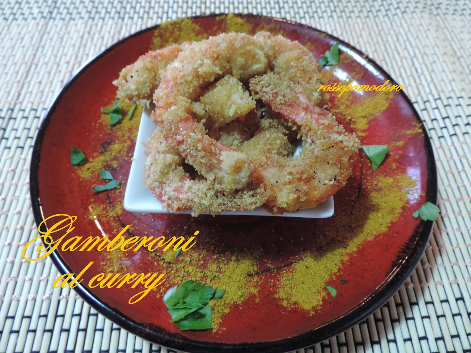 Gamberoni al curry gratinati al forno