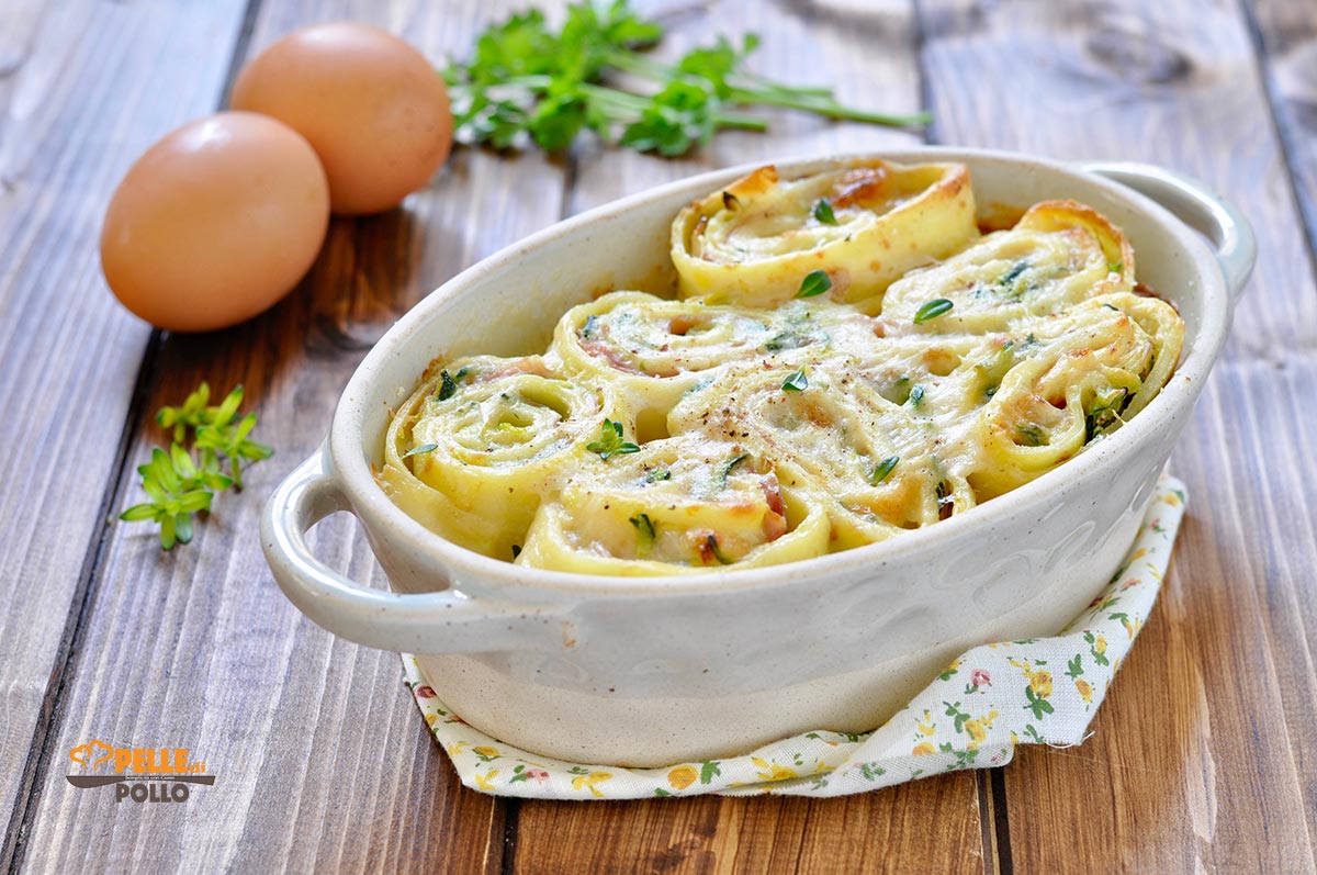 Girelle di crepes gratinate con zucchine e prosciutto