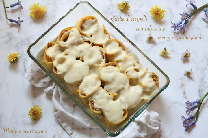 Girelle di crespelle con salsiccia e crema di parmigiano