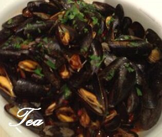 Impepata di cozze con i pomodori