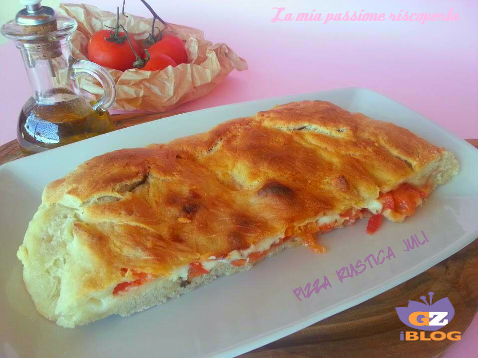Pizza rustica, alici pomodori origano, sale olive nere, olio di oliva..