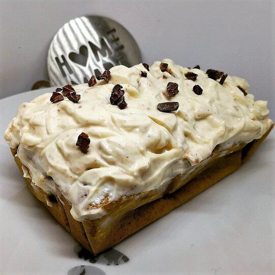Pumpkin plumcake with peanuts frosting