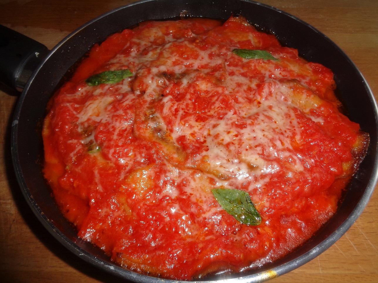 Ricetta-parmigiana con prosciutto e mozzarella di bufala