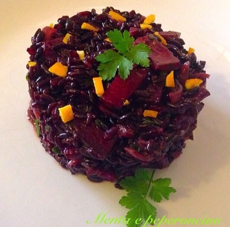 Ricetta riso venere con speck e arancia