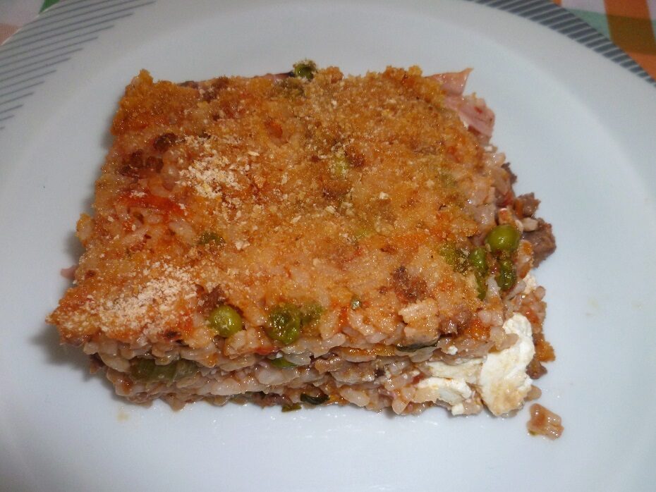 Riso al forno con piselli ricotta e salsiccia