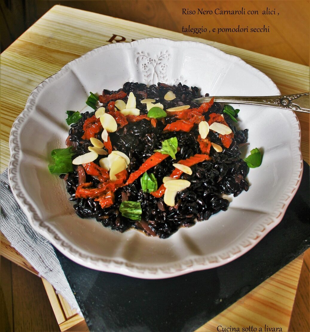 Riso nero carnaroli con alici , taleggio e pomodori secchi