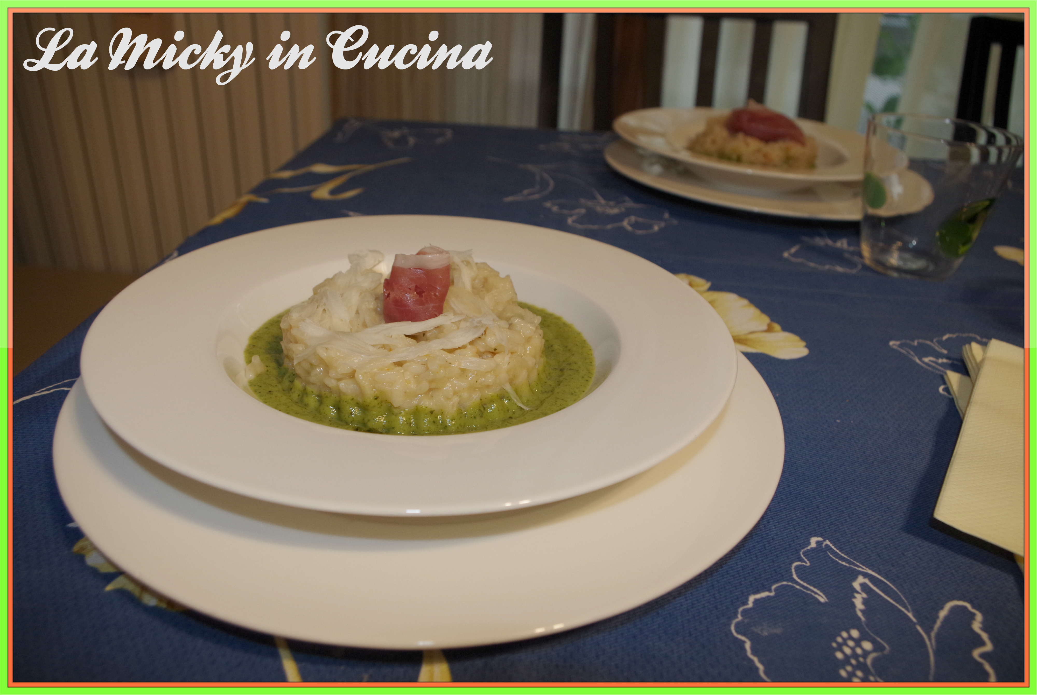 Risotto ai fiori di zucca su crema di zucchine con rosa di crudo e raspadura