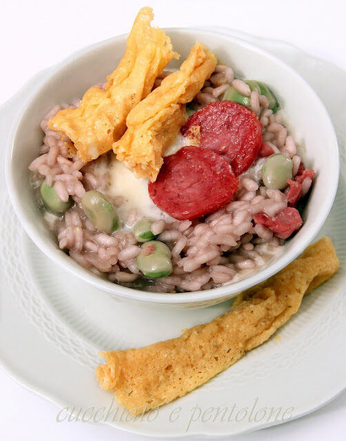 Risotto al lambrusco, strolghino di culatello, fave e fonduta al parmigiano