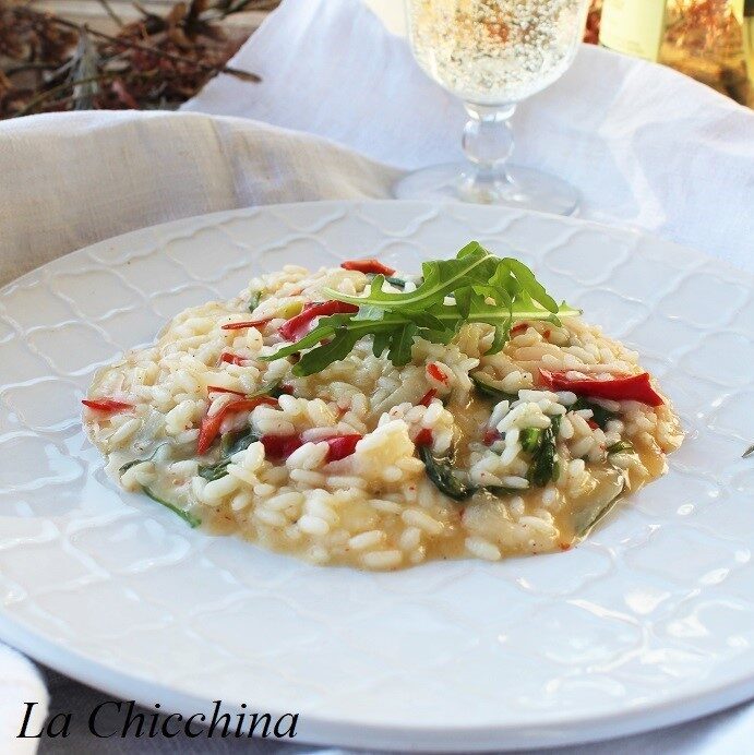 Risotto con peperoni dolci, rucola e toma giovane