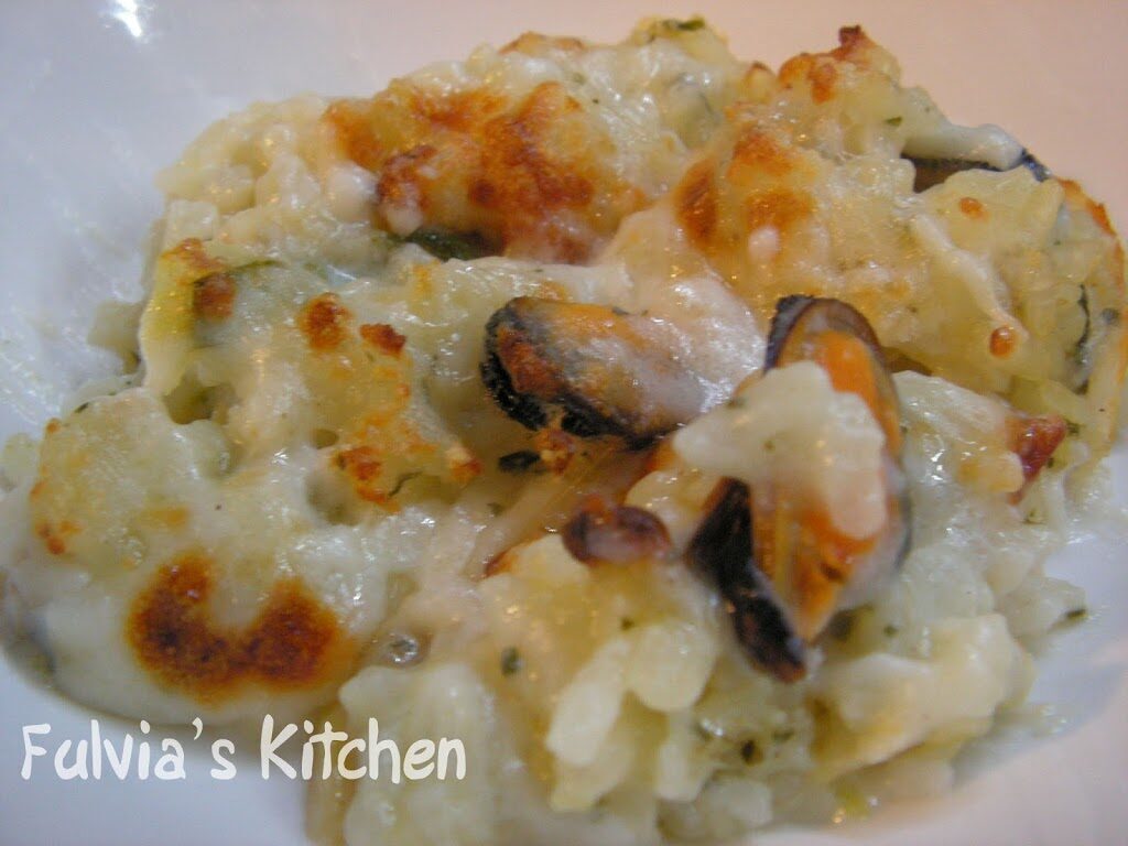 Risotto gratinato con zucchine, cozze e vongole