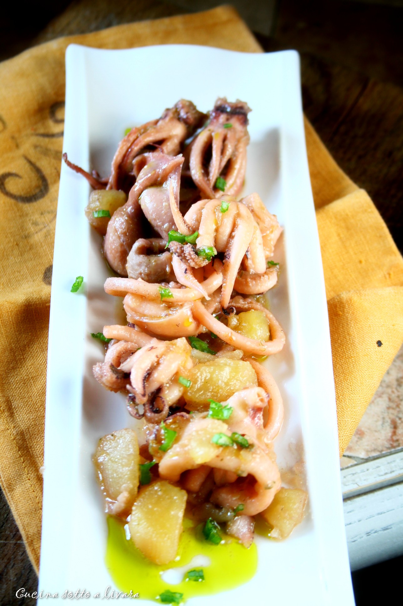 Seppie e calamari con patate e la loro crema