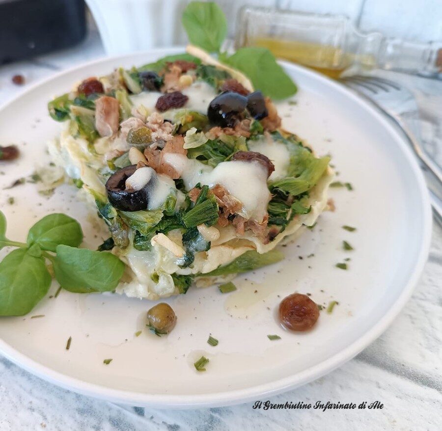 Sformato di pane carasau con scarola olive e capperi