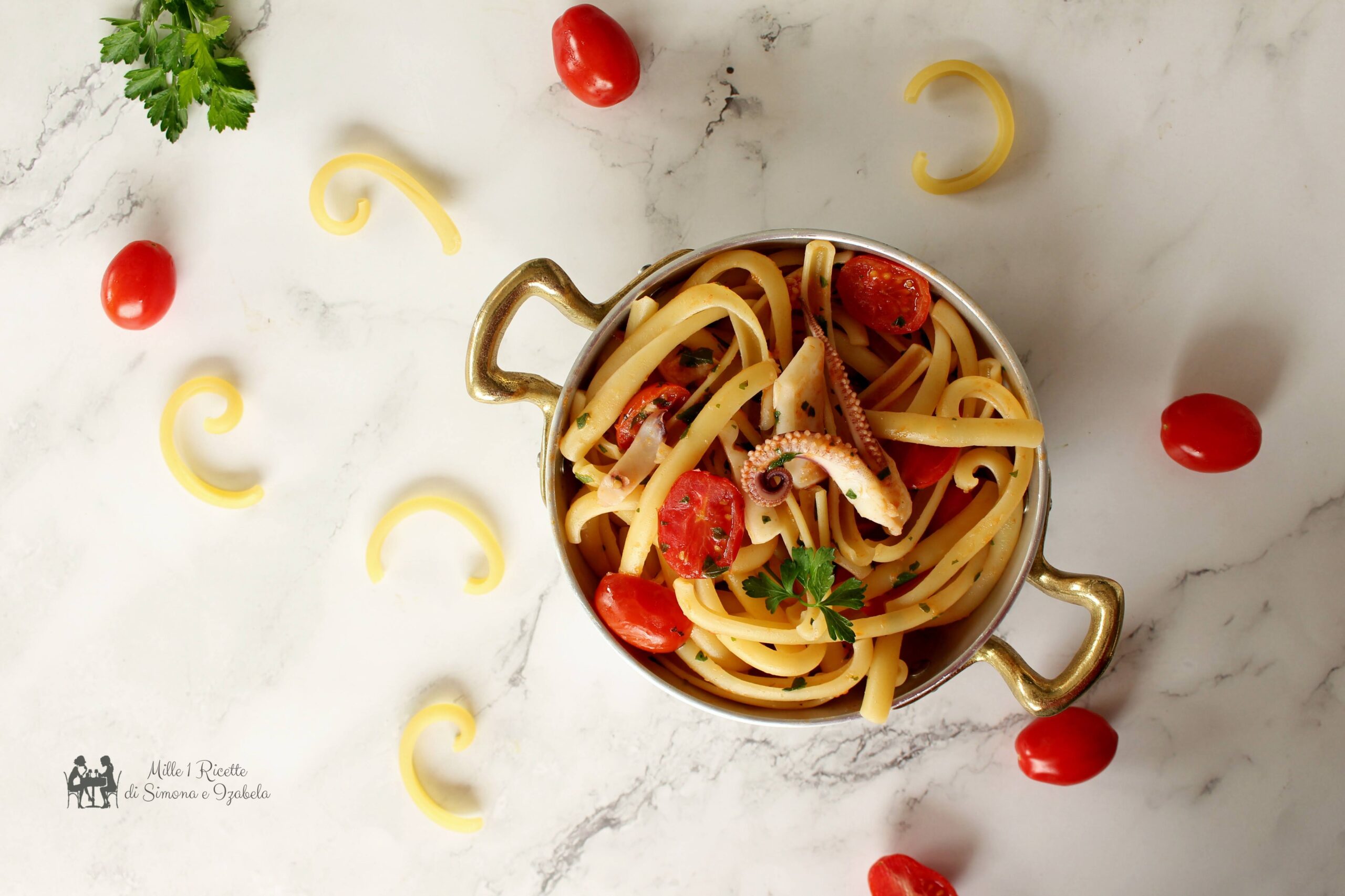 Spaccatelle con calamari e pomodorino