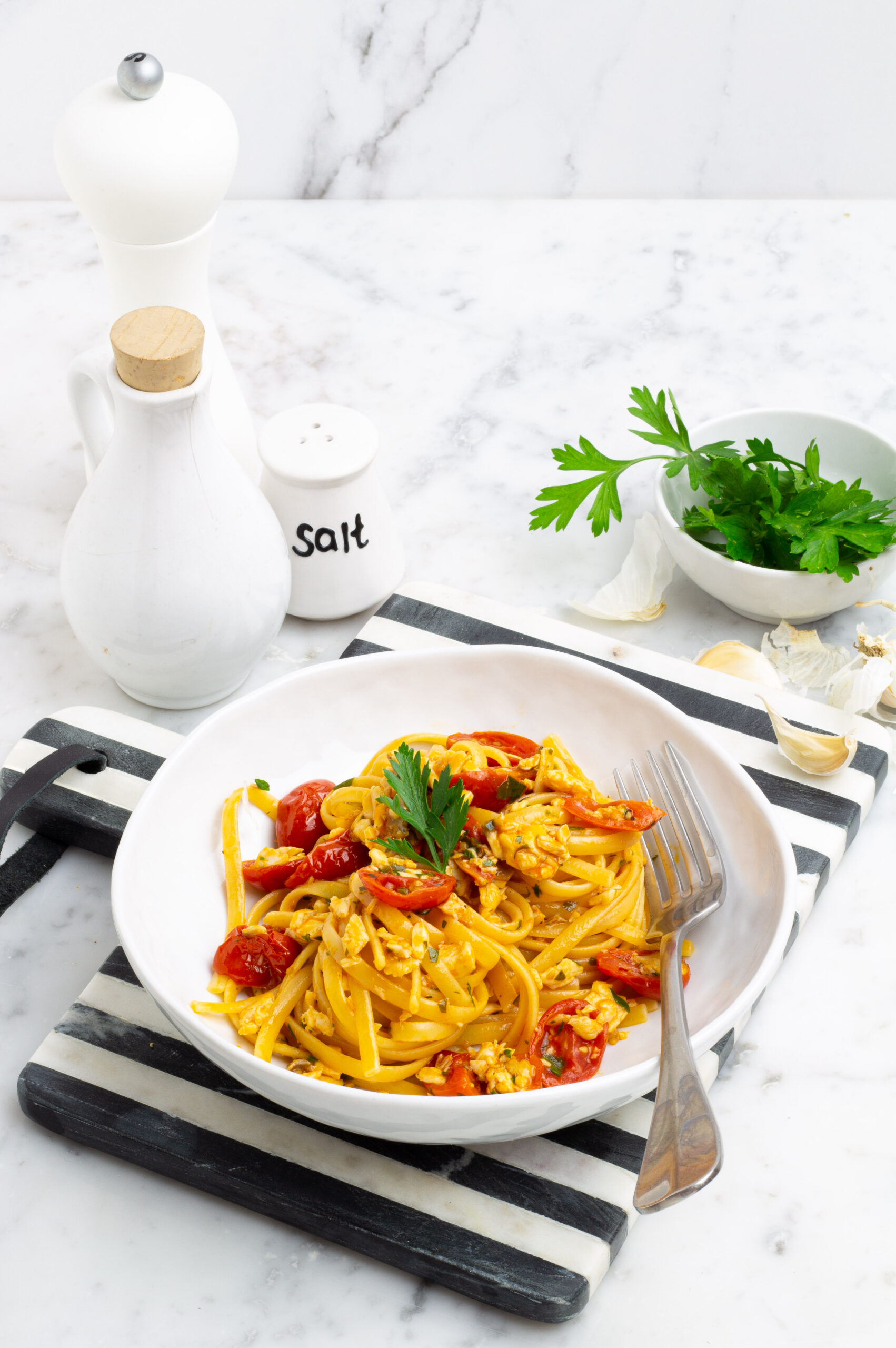 Spaghetti con sugo di branzino