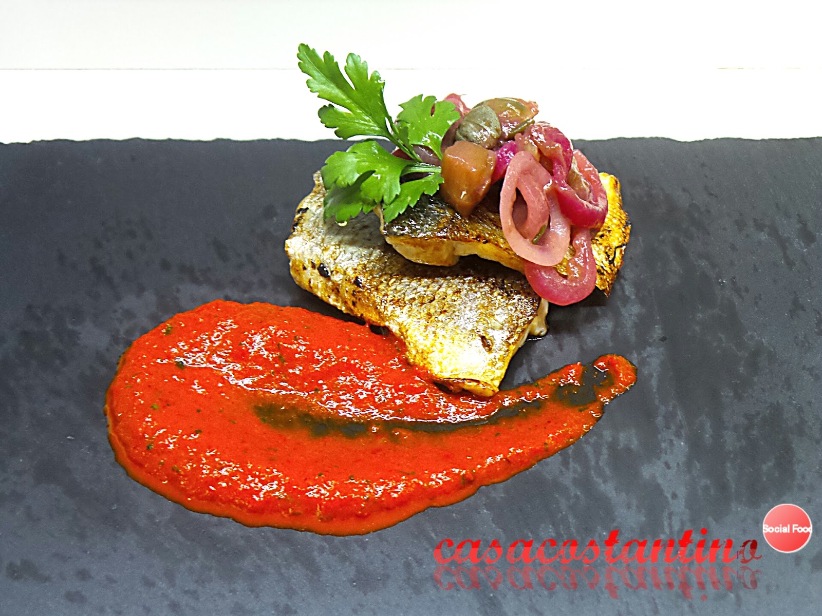 Spigola scottata con crema di peperoni ed agrodolce di tropea al rabarbaro