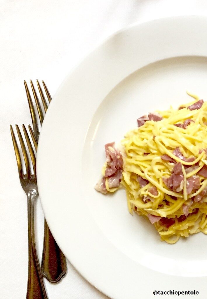 Tagliolini con crema di parmigiano e fiocchi di culatello