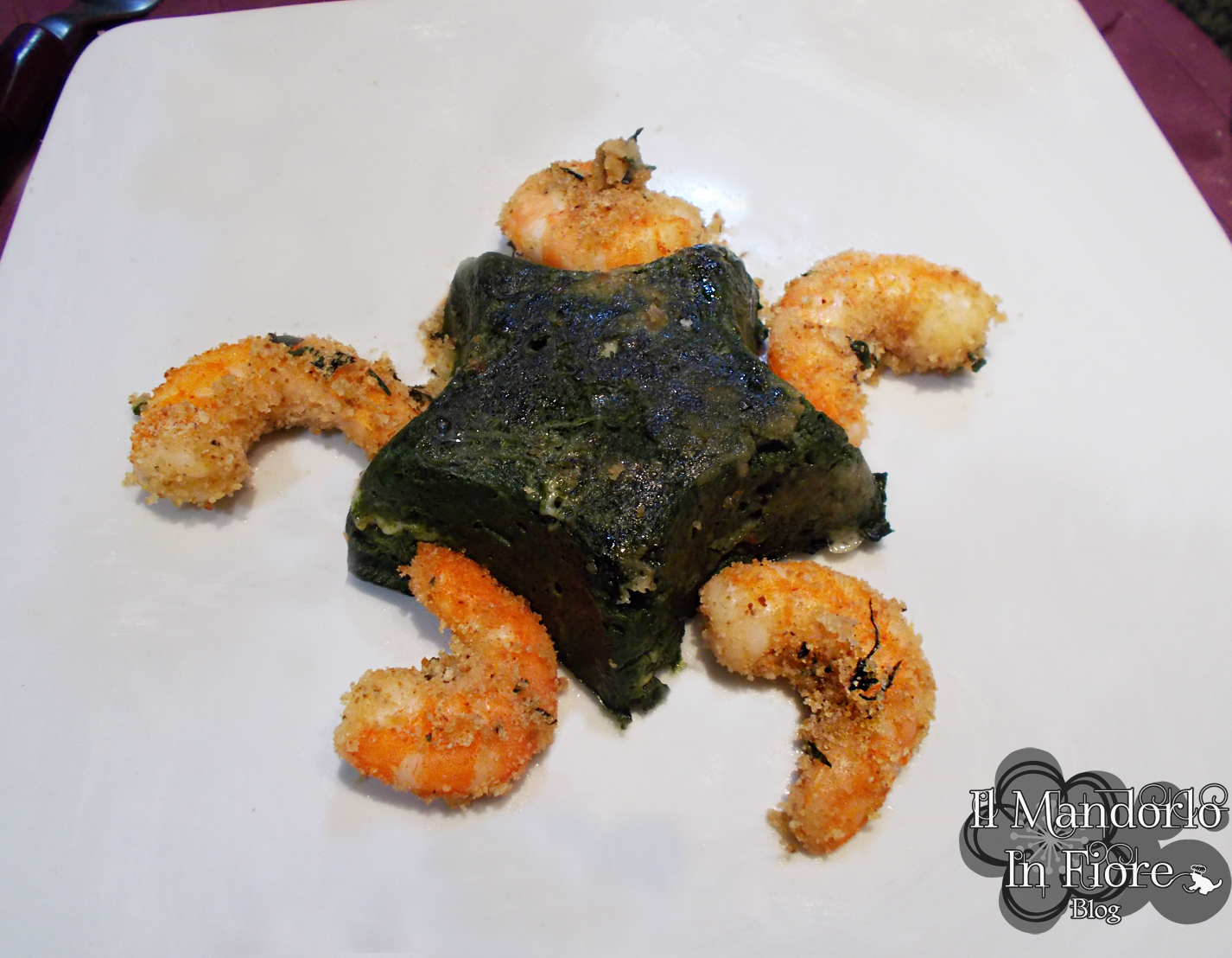 Timballetto di spinaci e gamberi gratinati