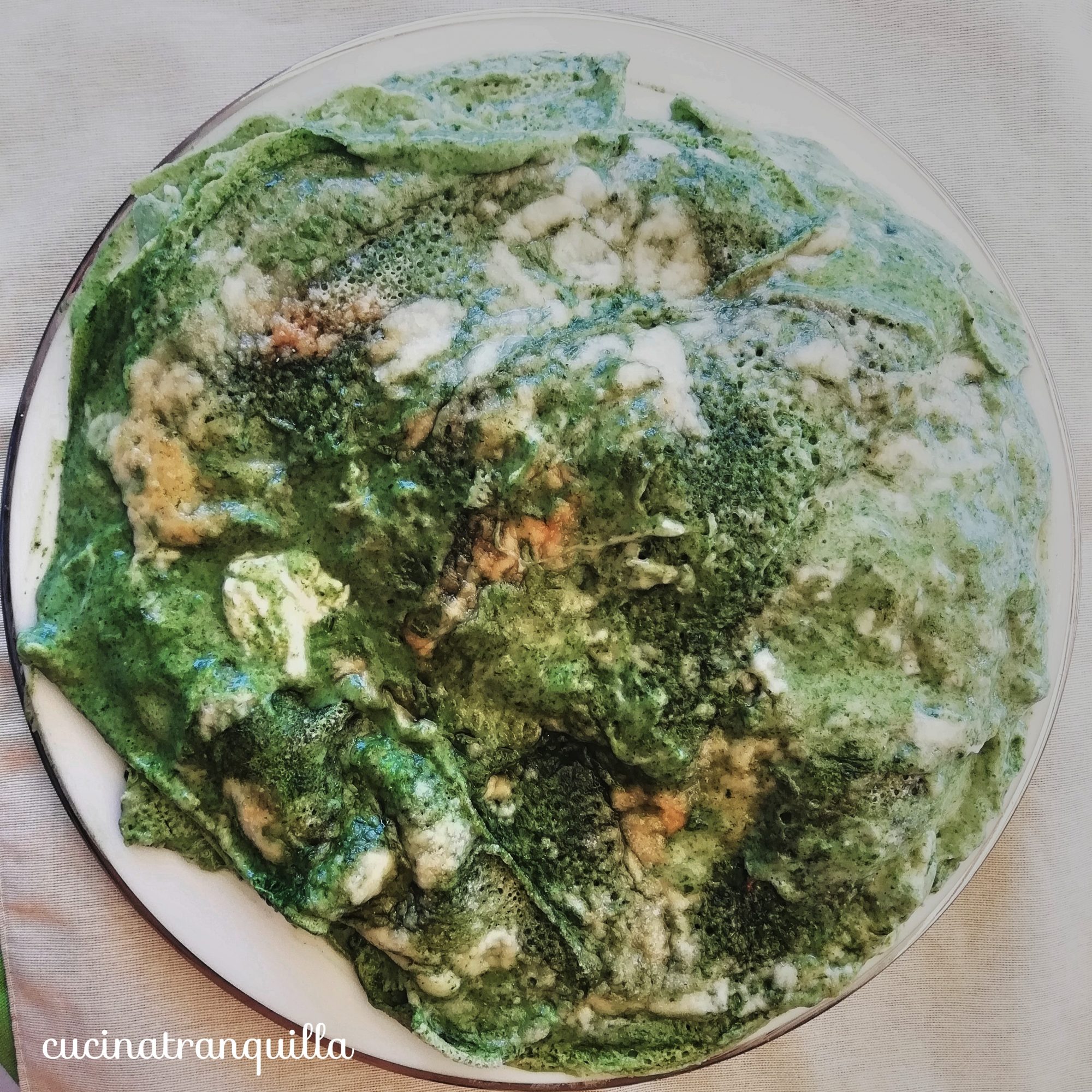 Timballo di crepes di farina di riso, spinaci, stracchino e provoletta