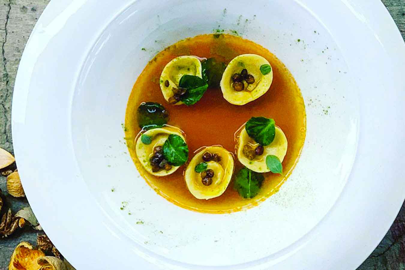 Tortelli di branzino in brodo di lenticchie