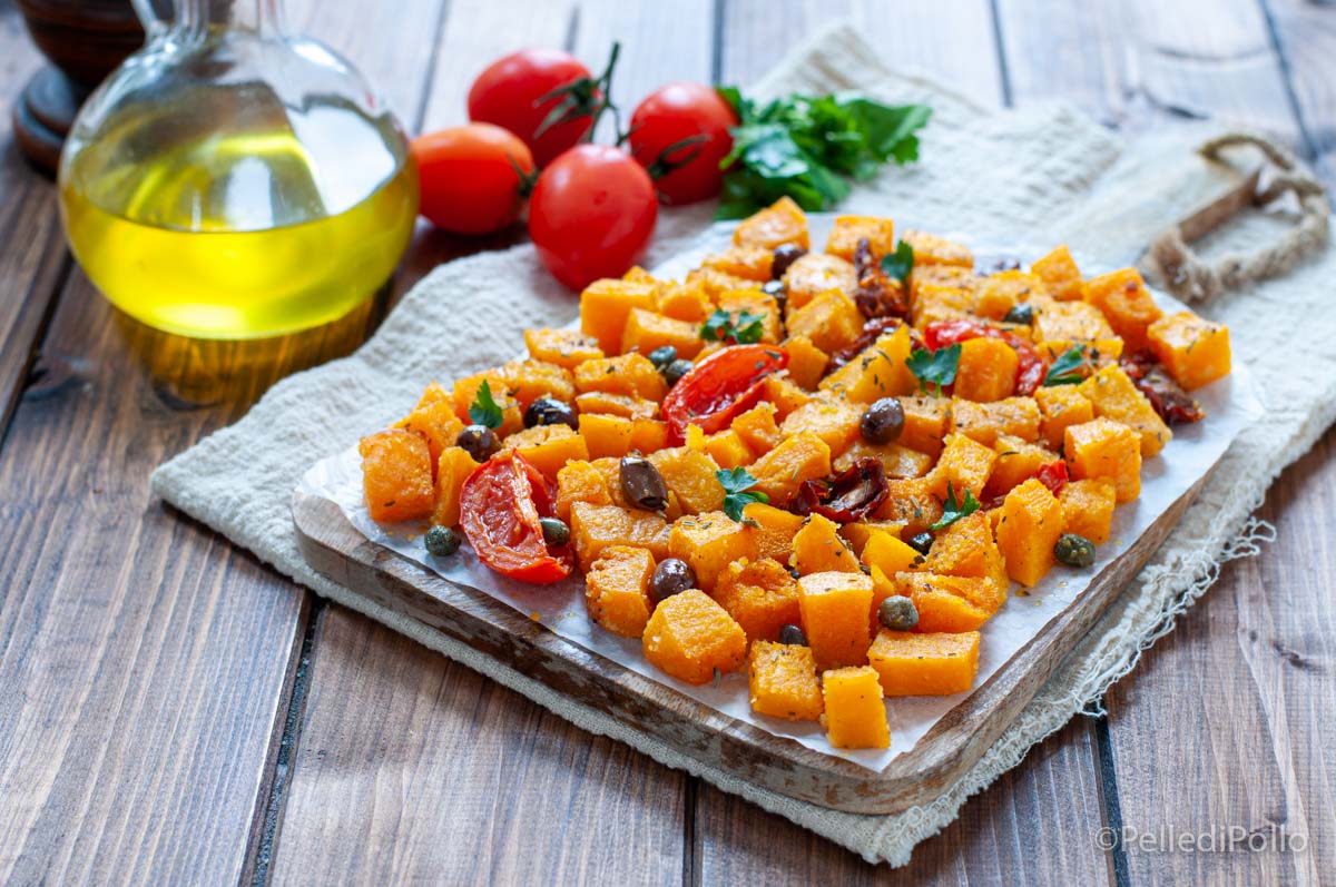 Zucca gratinata con olive, capperi e pomodori