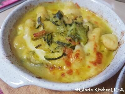 Gnocchi con zucchine, speck e scamorza al forno