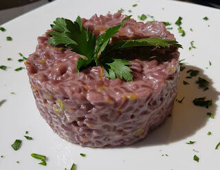 Risotto al primitivo di manduria e fiori di zucca