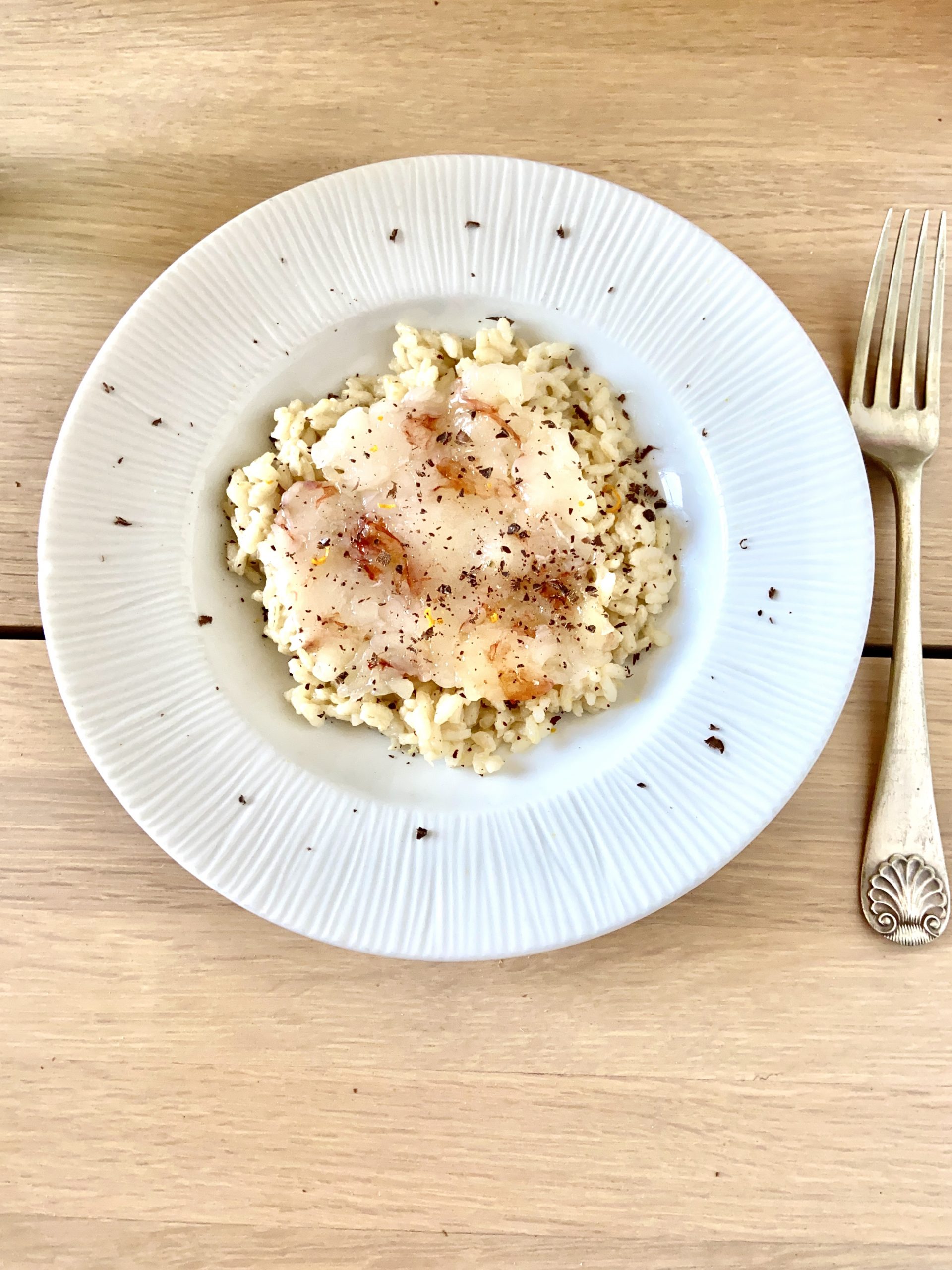 Risotto all’arancia con cruditè di gamberi e cioccolato