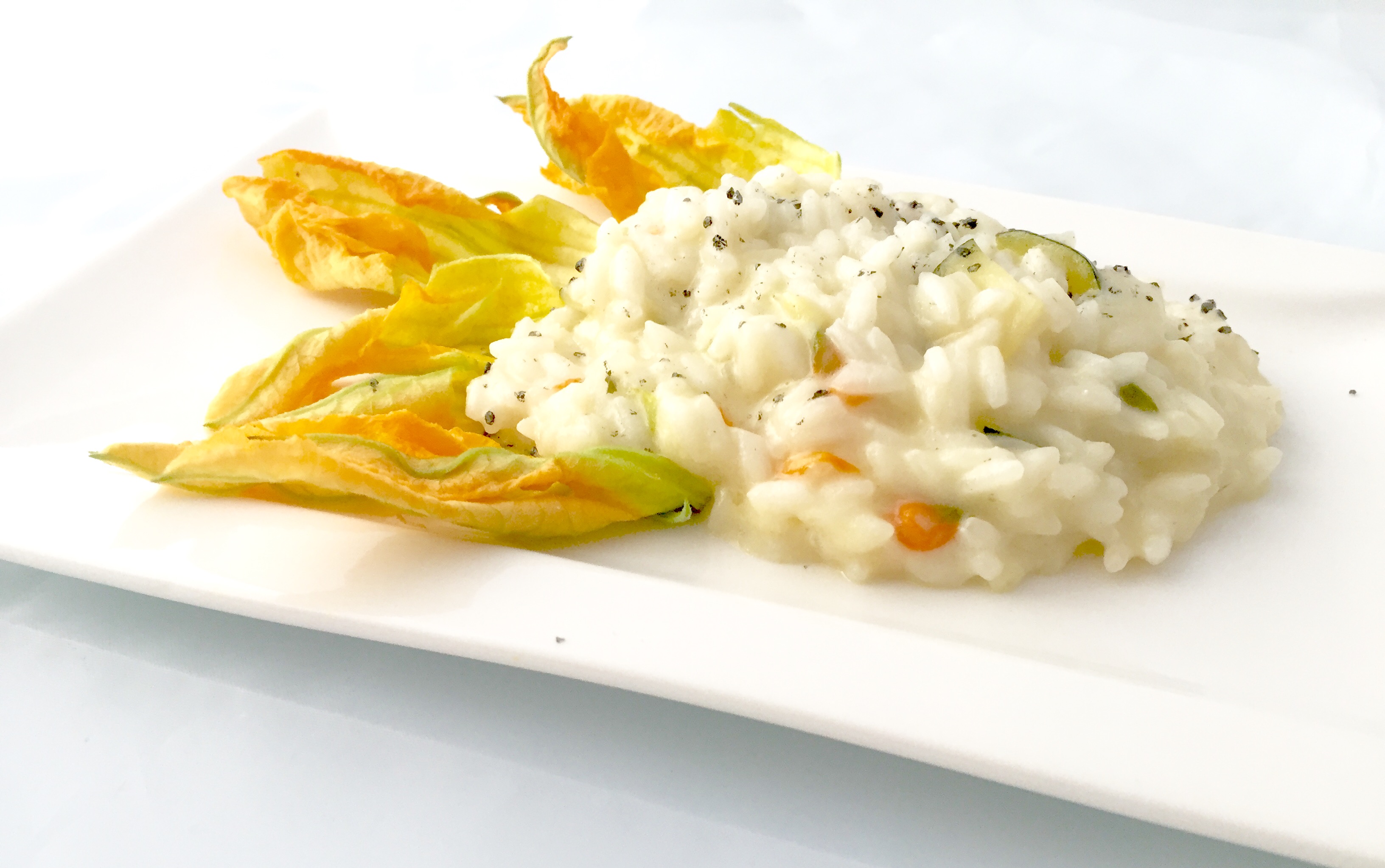 Risotto con fiori di zucca mantecato alla robiola