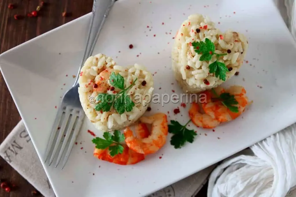 Cuori di risotto al brandy, mazzancolle e pepe rosa per stupire